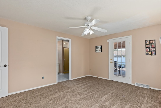 empty room with carpet flooring and ceiling fan