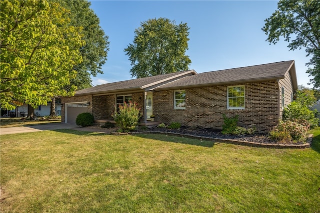 single story home featuring a front lawn and a garage