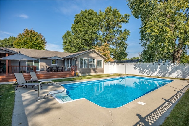 view of pool featuring a deck and a patio