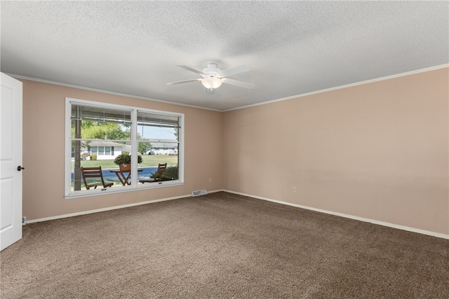 carpeted empty room with ceiling fan, crown molding, and a textured ceiling