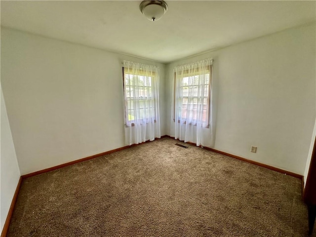 1321 Rudy Ave, Mattoon, IL 61938 - spare room featuring carpet and baseboards