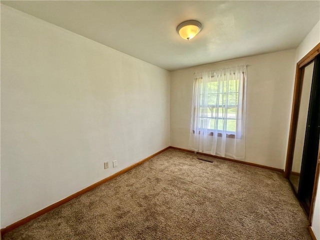 1321 Rudy Ave, Mattoon, IL 61938 - unfurnished bedroom featuring carpet floors and baseboards