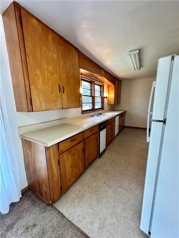 1321 Rudy Ave, Mattoon, IL 61938 - kitchen with white appliances, brown cabinets, and light countertops
