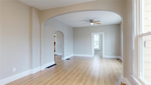 unfurnished room featuring ceiling fan and light wood-type flooring