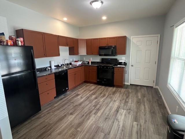 602 S Linden St, Effingham, IL 62401 - kitchen featuring black appliances, dark countertops, wood finished floors, and recessed lighting