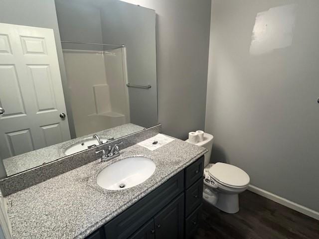 602 S Linden St, Effingham, IL 62401 - bathroom with wood finished floors, vanity, and a shower