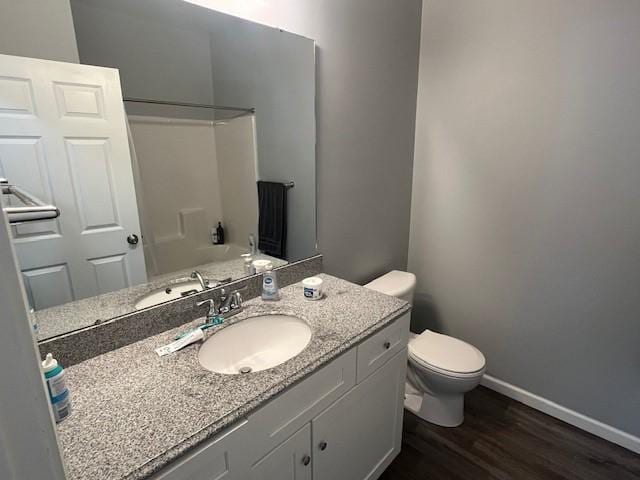 602 S Linden St, Effingham, IL 62401 - bathroom with wood finished floors, vanity, and shower / bath combination