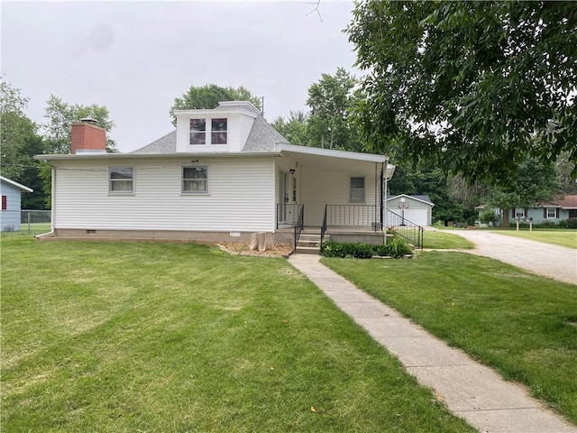 828 S Indiana St, Ashmore, IL 61912 - bungalow-style house featuring covered porch, a front lawn, roof with shingles, crawl space, and a chimney