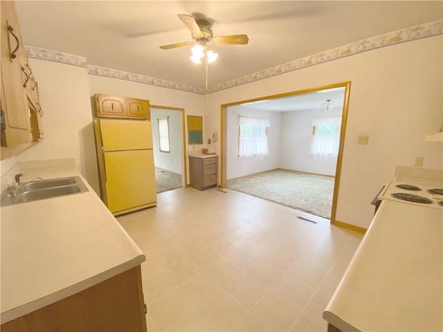 828 S Indiana St, Ashmore, IL 61912 - kitchen featuring white appliances, a ceiling fan, light countertops, and light floors
