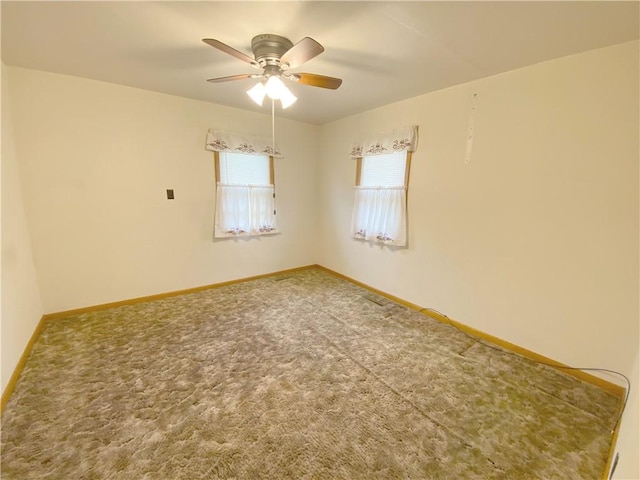 828 S Indiana St, Ashmore, IL 61912 - empty room with ceiling fan and carpet floors