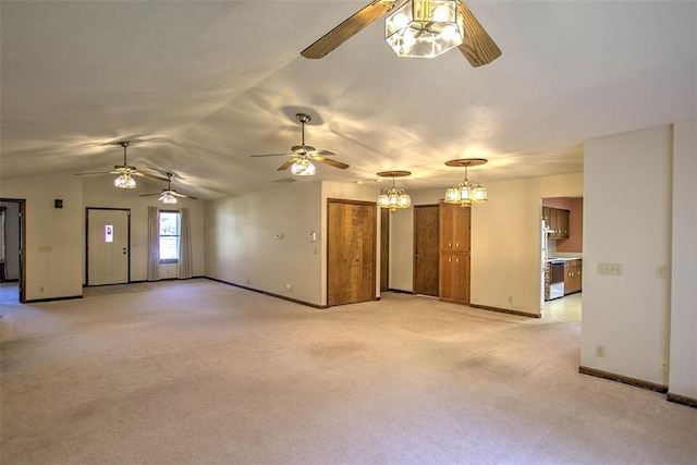 2839 E Wood St, Decatur, IL 62521 - unfurnished living room with baseboards, light carpet, vaulted ceiling, and ceiling fan with notable chandelier