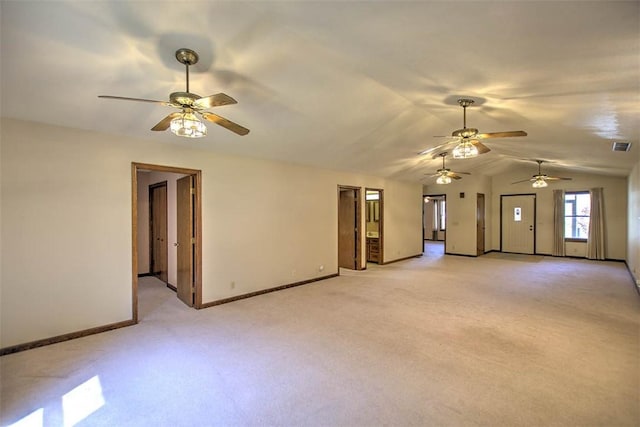 2839 E Wood St, Decatur, IL 62521 - unfurnished living room with light colored carpet, ceiling fan, baseboards, and lofted ceiling