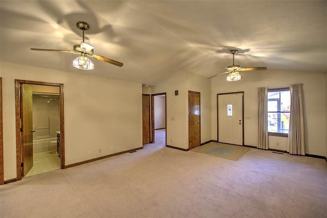 2839 E Wood St, Decatur, IL 62521 - entryway with lofted ceiling, light carpet, baseboards, and ceiling fan