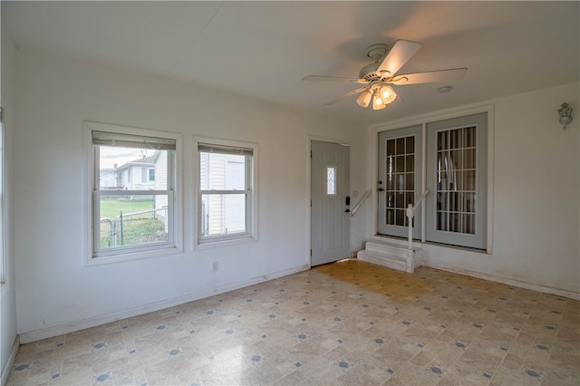 interior space featuring ceiling fan