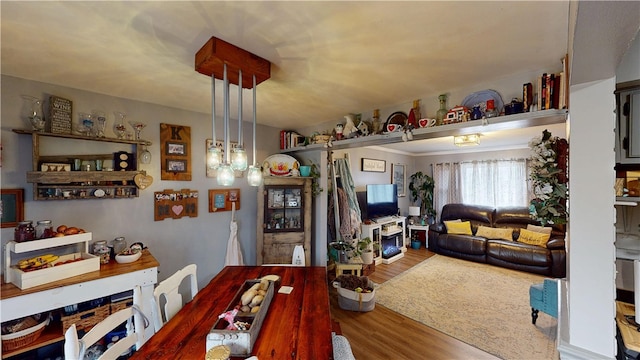 dining space with hardwood / wood-style floors