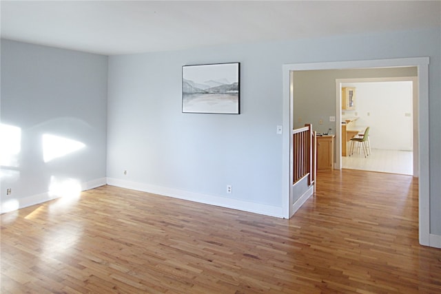 spare room featuring hardwood / wood-style flooring