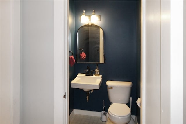 bathroom with toilet and sink