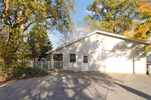 view of side of home featuring a garage