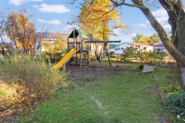 view of playground featuring a lawn