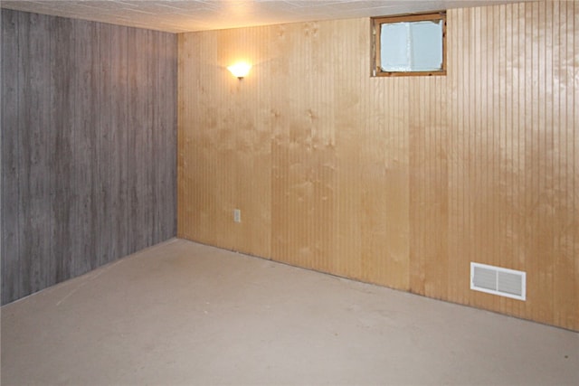 basement with wooden walls