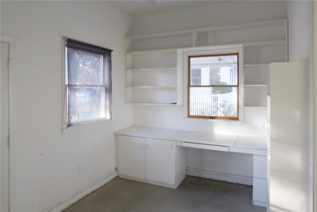 unfurnished office with built in desk