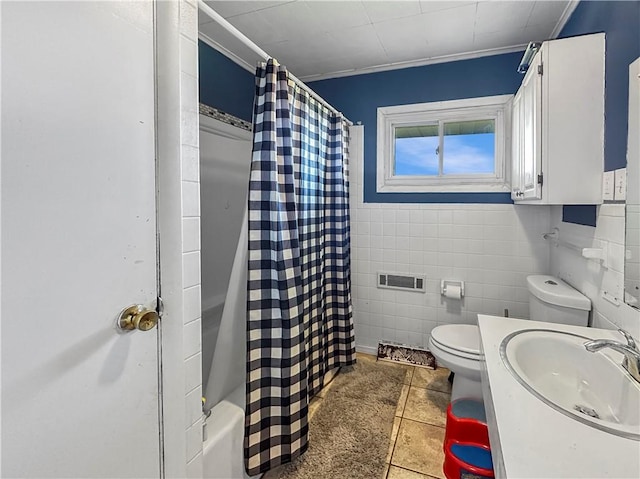full bath with tile walls, a sink, toilet, a shower with shower curtain, and tile patterned flooring