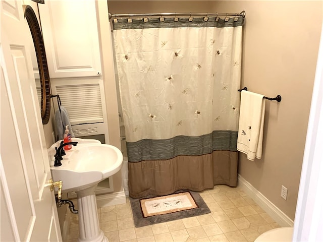 bathroom featuring a shower with curtain and tile patterned floors