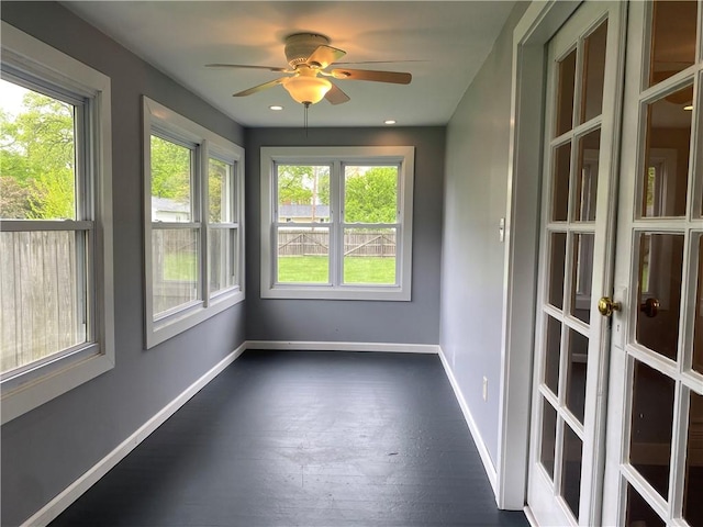 unfurnished sunroom featuring a wealth of natural light and french doors