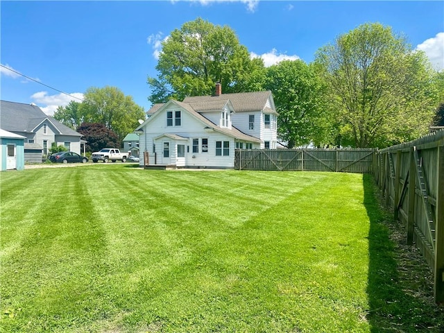 view of yard with a fenced backyard