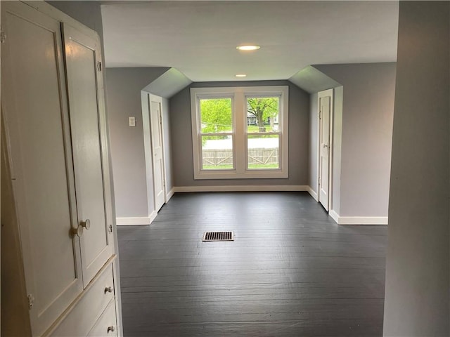 bonus room with recessed lighting, baseboards, visible vents, and dark wood finished floors