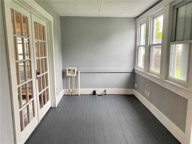 unfurnished sunroom with french doors