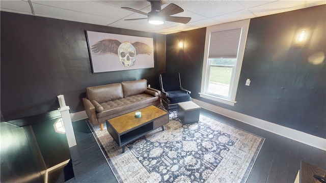 1006 Chicago Ave, Danville, IL 61832 - living area featuring a ceiling fan, baseboards, a drop ceiling, and wood finished floors