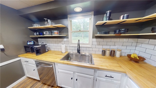 1006 Chicago Ave, Danville, IL 61832 - kitchen featuring butcher block countertops, a sink, open shelves, and dishwasher