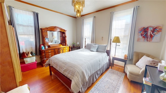 bedroom with ornamental molding and light wood-type flooring