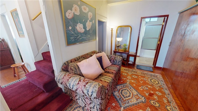 living room featuring stairway and wood finished floors