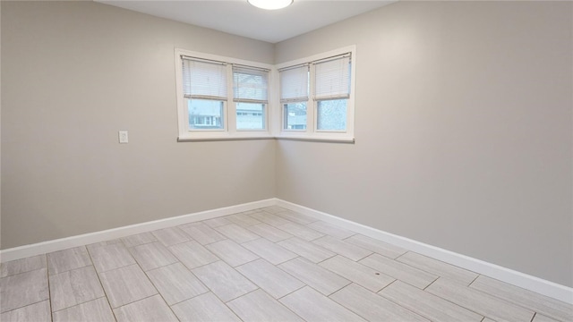 empty room with baseboards