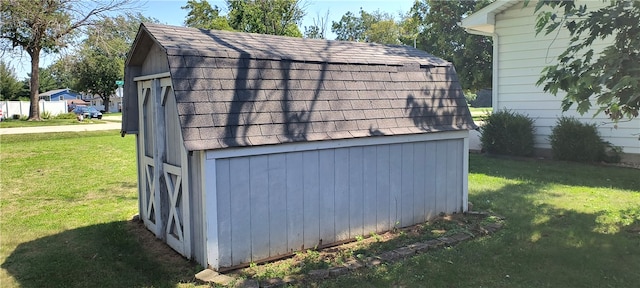 view of outdoor structure with a yard