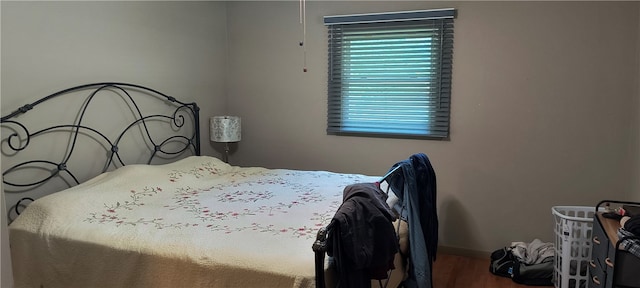 bedroom with hardwood / wood-style floors