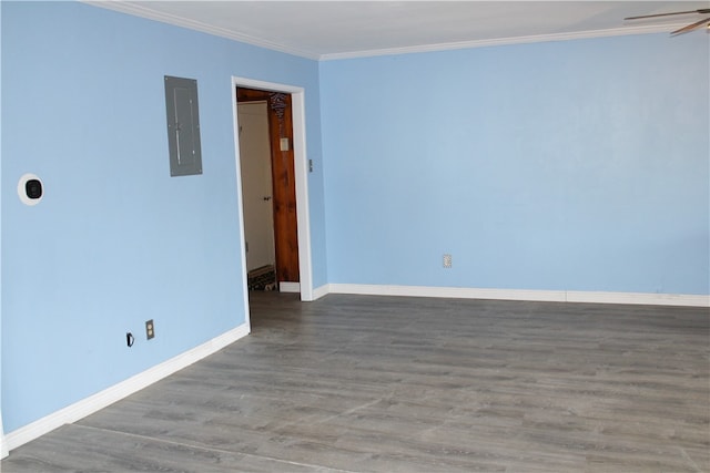 unfurnished room featuring hardwood / wood-style floors, electric panel, ceiling fan, and crown molding