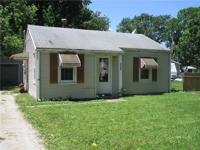 1729 N 20th St, Springfield, IL 62702 - bungalow featuring driveway, a shingled roof, and a garage