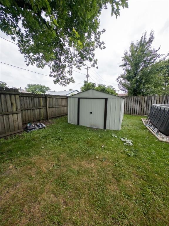114 E 11th St, Georgetown, IL 61846 - fenced backyard featuring a storage shed