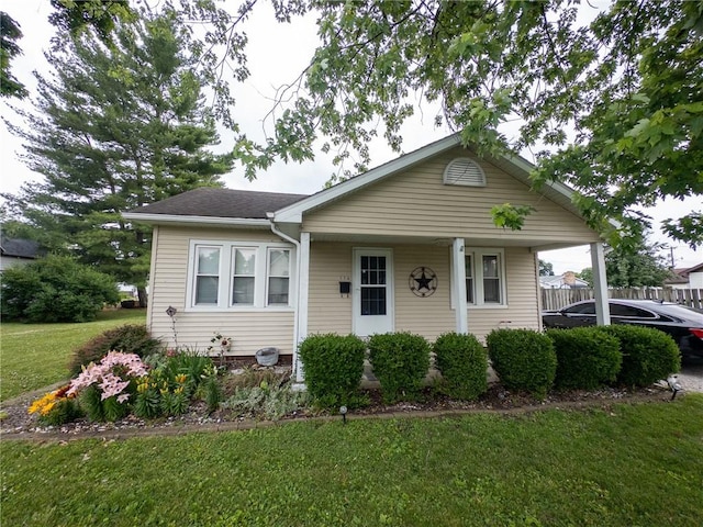 114 E 11th St, Georgetown, IL 61846 - bungalow featuring a front lawn and a shingled roof
