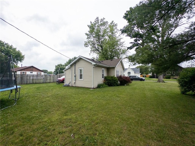 114 E 11th St, Georgetown, IL 61846 - view of yard with a trampoline