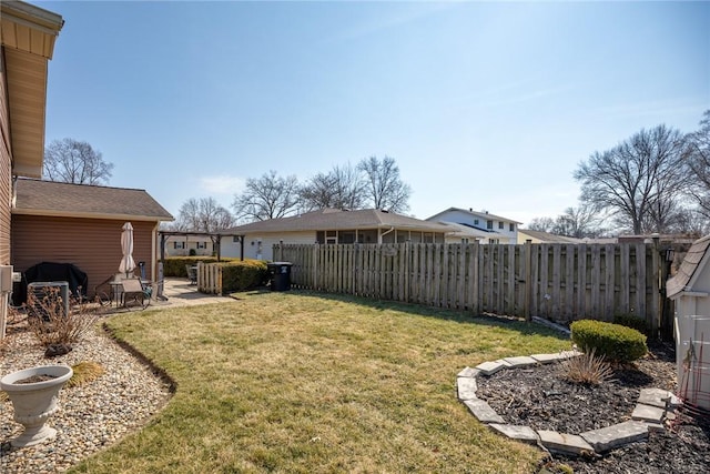 view of yard featuring a patio area and a fenced backyard