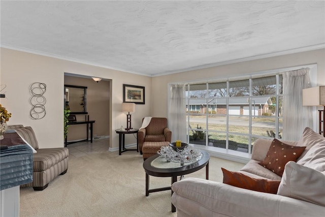 living area with baseboards, ornamental molding, a textured ceiling, and light colored carpet