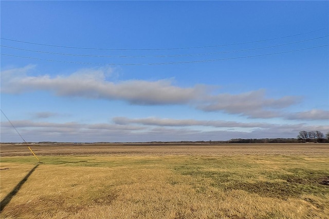 view of yard with a rural view