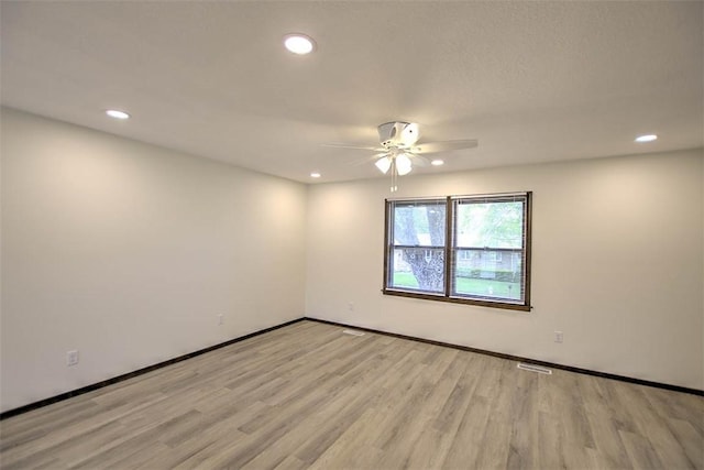 113 White Pines Cir, Decatur, IL 62521 - unfurnished room featuring a ceiling fan, light wood-style flooring, recessed lighting, and baseboards