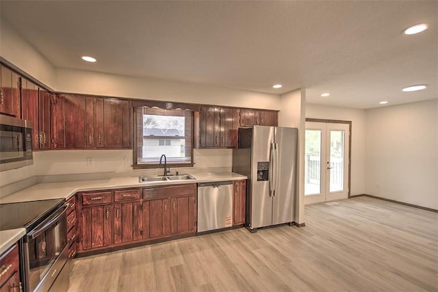 113 White Pines Cir, Decatur, IL 62521 - kitchen featuring appliances with stainless steel finishes, a sink, light wood finished floors, light countertops, and recessed lighting