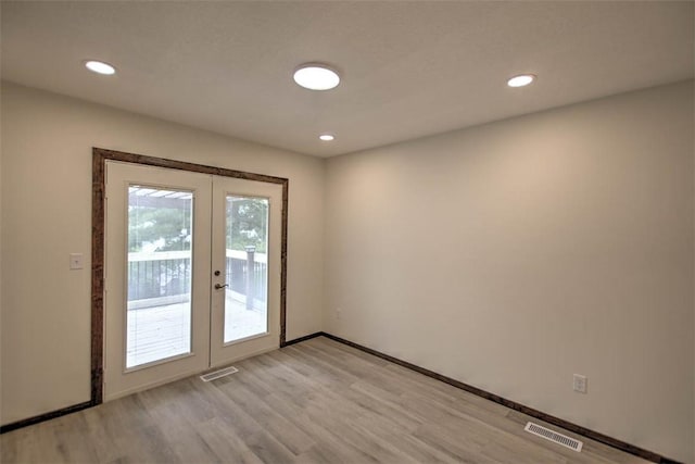 113 White Pines Cir, Decatur, IL 62521 - entryway with french doors, light wood-type flooring, recessed lighting, and baseboards