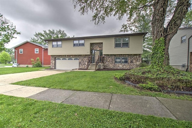 113 White Pines Cir, Decatur, IL 62521 - bi-level home featuring stone siding, an attached garage, a front yard, and driveway